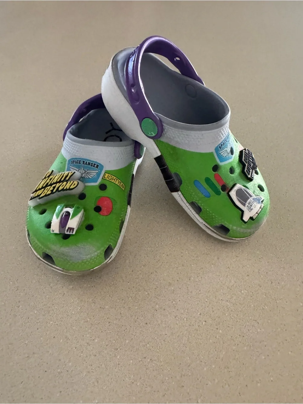 CROCS Kids Green Clogs with Purple Heel Strap and Space Charms